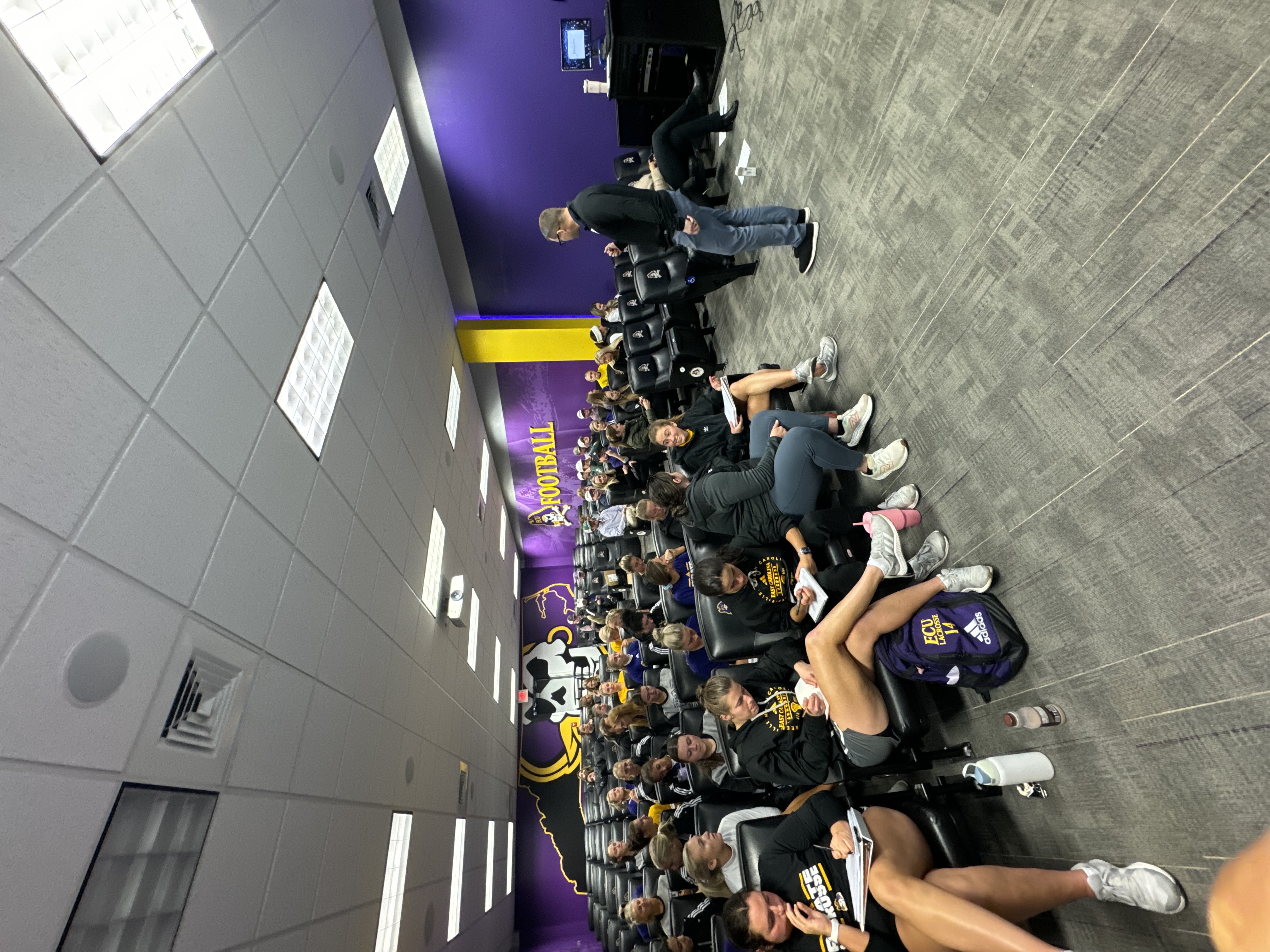 ECU football athletes in session